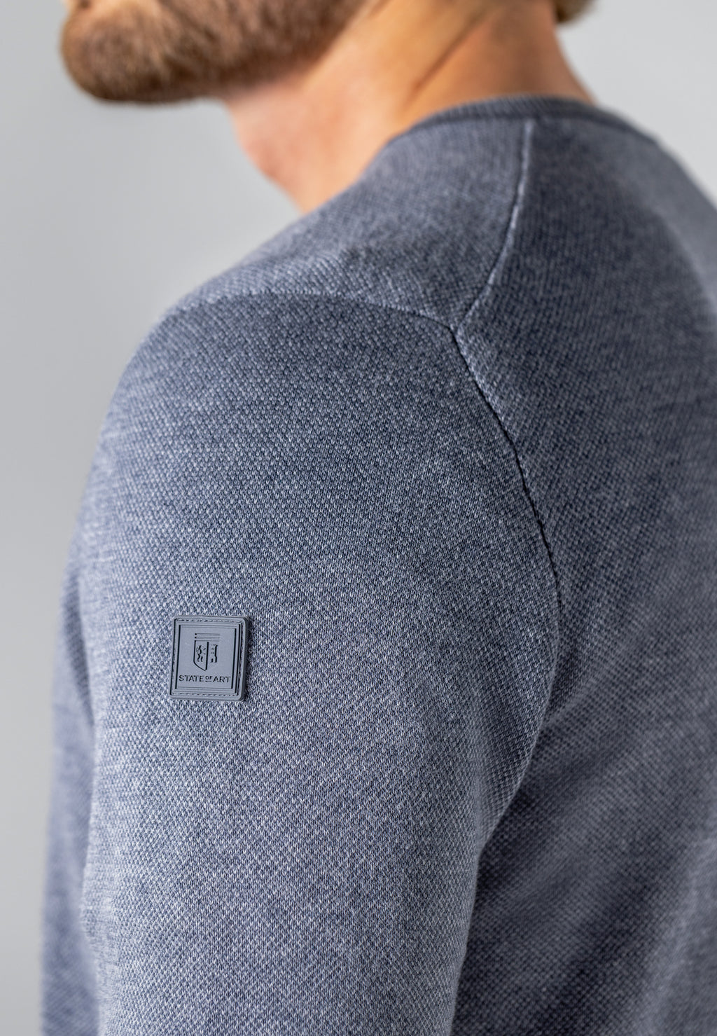Oxford trui met rubberen badge