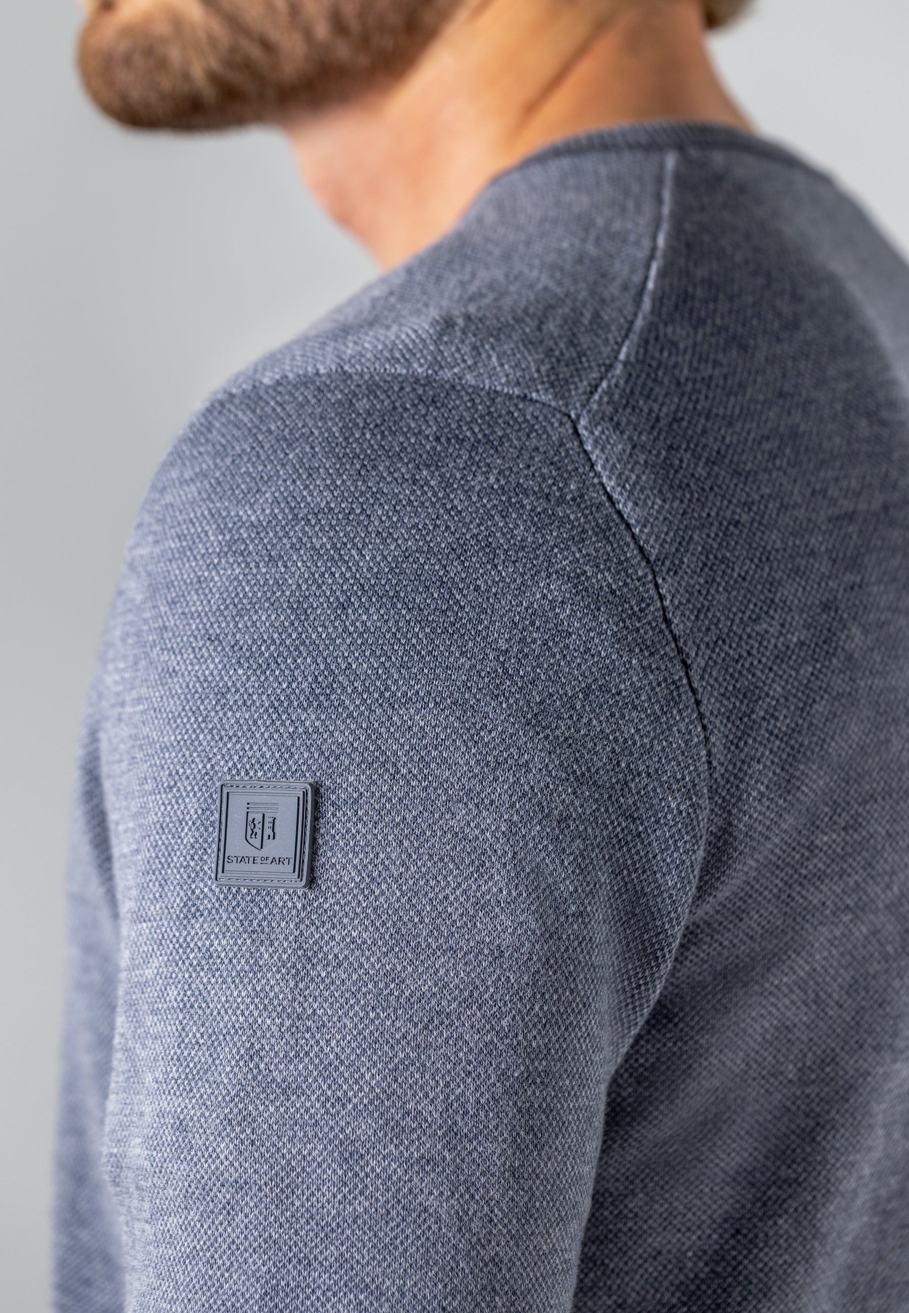 Pull Oxford à badge en caoutchouc