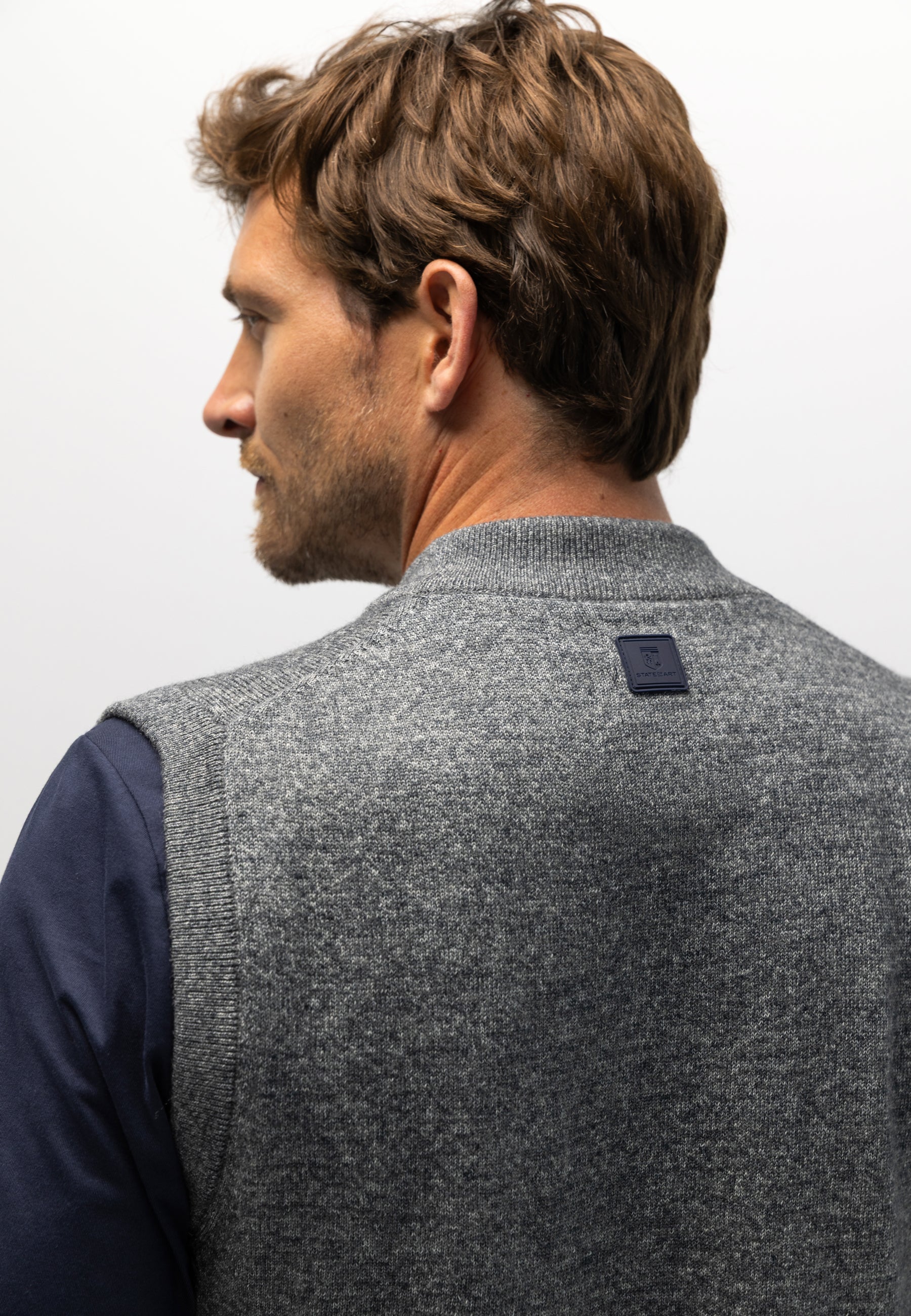 Knitted gilet with bomber collar