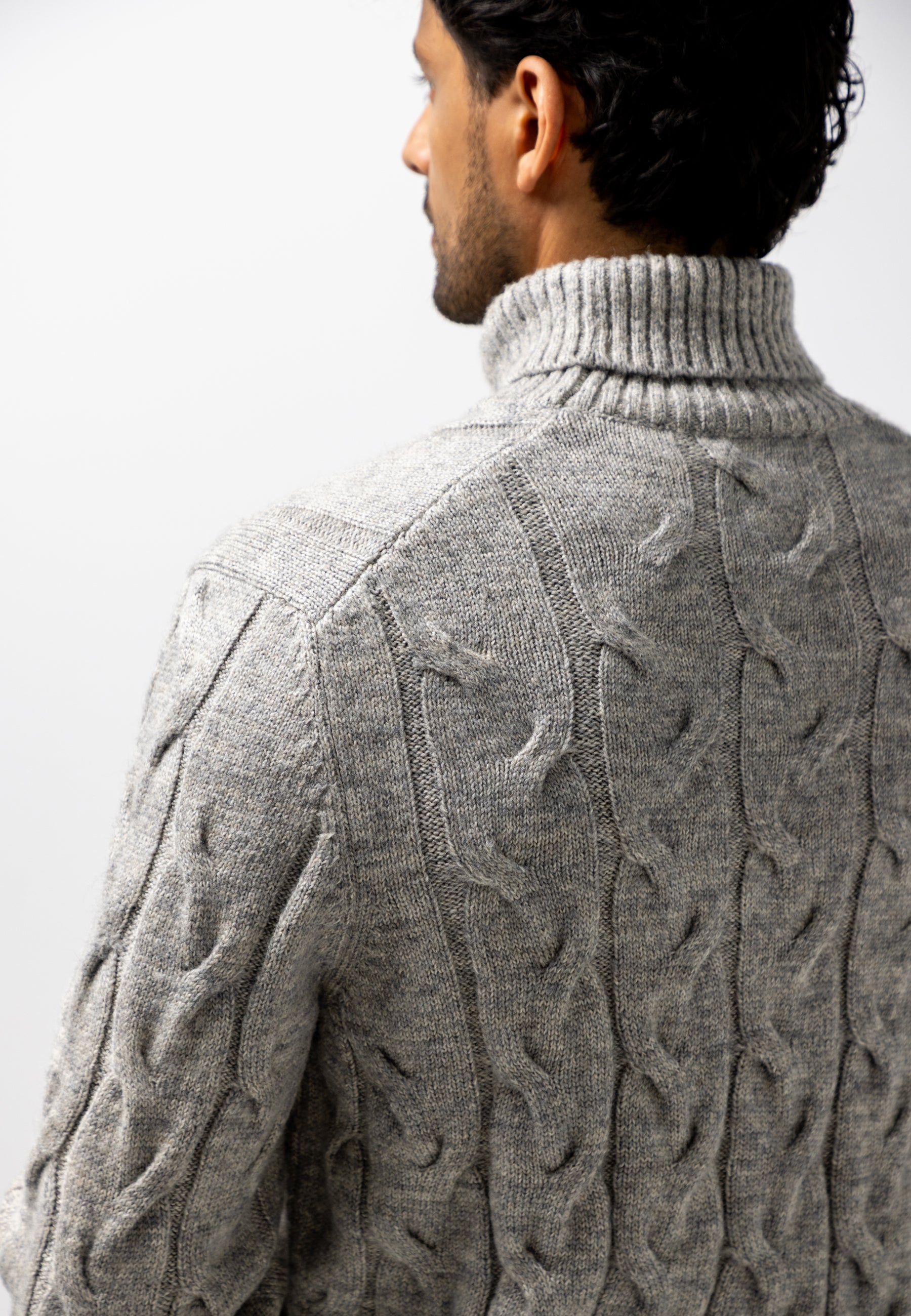 Turtleneck jumper with cable-knit pattern