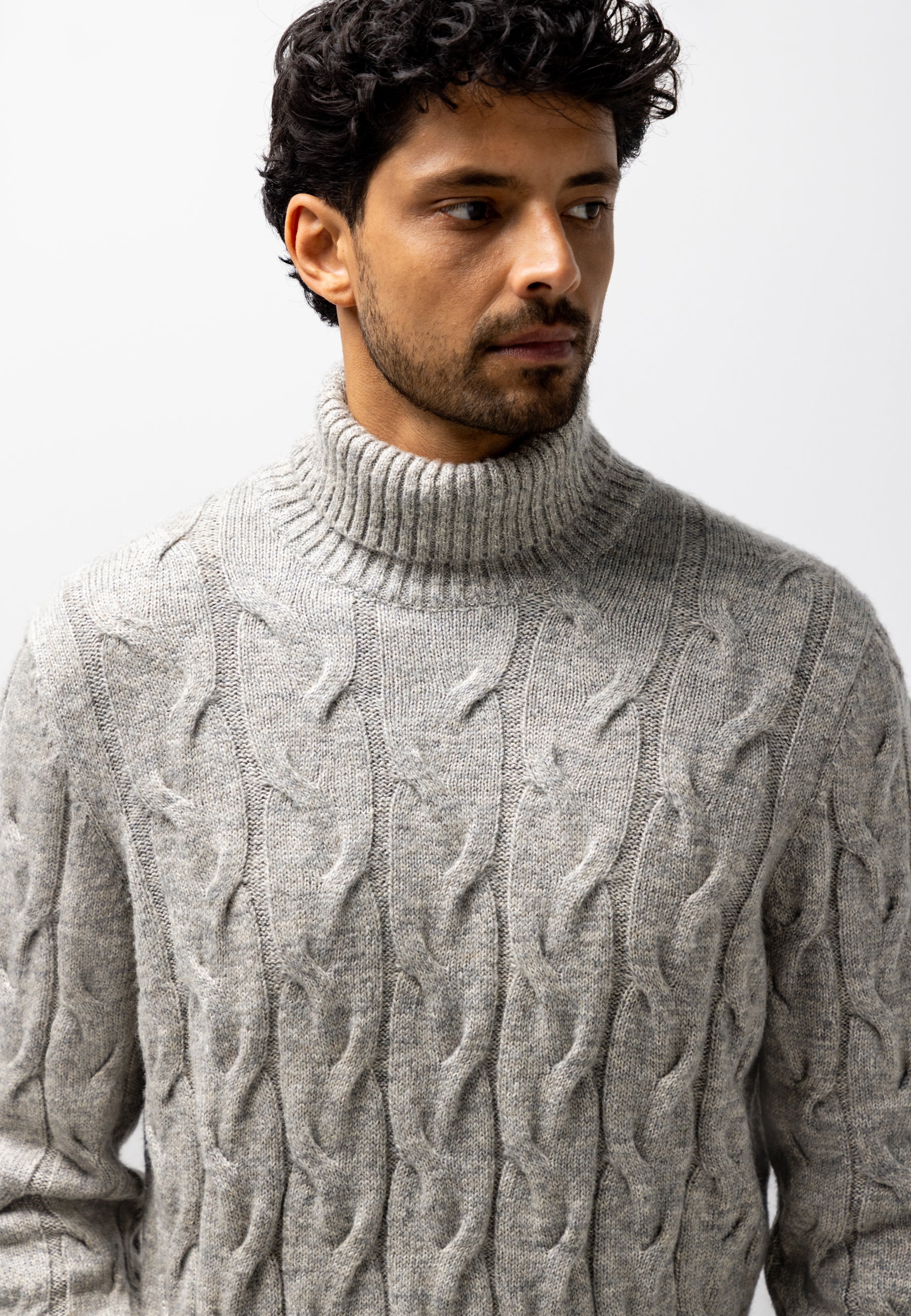 Turtleneck jumper with cable-knit pattern